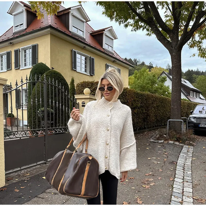 Gebreid damesvest met knopen – Oversized model met ballonmouwen